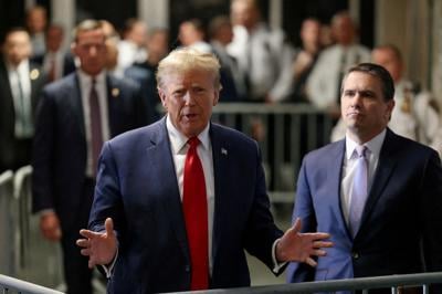 FILE PHOTO: Former U.S. President Trump attends a hearing on a criminal case linked to a hush money payment, in New York City